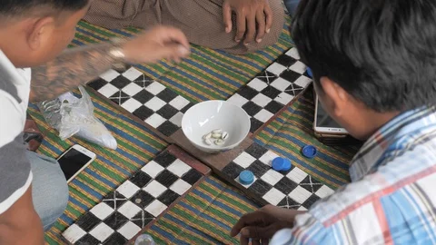 Men playing board game with shell dice,Mandalay,Burma Stock Footage 100873763