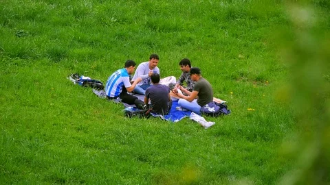 Men playing cards outside Stock Footage 89932864