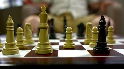 Men playing chess on a chessboard Stock Footage 93518985