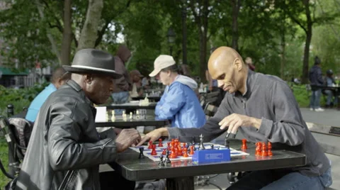 Men playing chess in Washington Square Park in the Spring in slow motion 4K NYC Stock Footage 50155474
