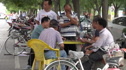 Men playing Chinese Chess on sidewalk, Jiayuguan Stock Footage 47451812