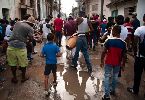 Men playing drums walking down the street Stock Photos