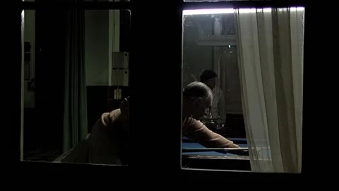 Men Playing Five Pin Billiards Seen Through Window in Rustic Argentine Bar  Stock Footage 154419181
