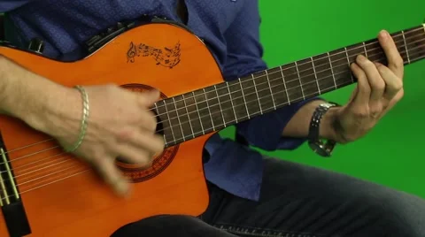 Men Playing Guitar On Green Screen Stock Footage 63299626