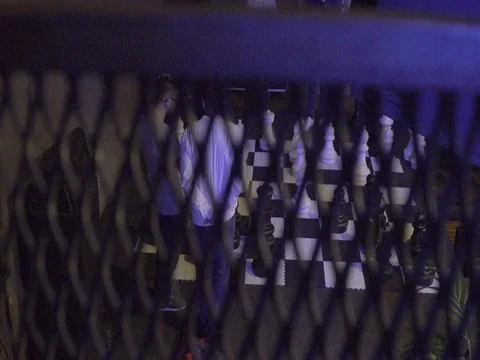 Men playing huge chess game festival Stock Footage 78609631