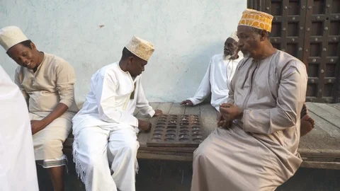 Men playing mancala Stock Footage 85775396