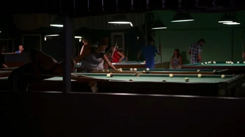 Men playing pool in the bar the night Stock Footage 53141797