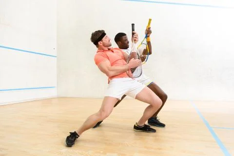 Men playing squash Stock Photos