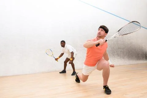 Men playing squash Stock Photos