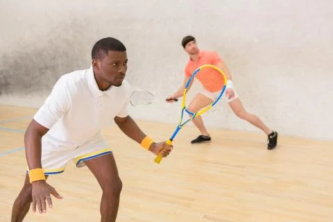 Men playing squash Stock Photos