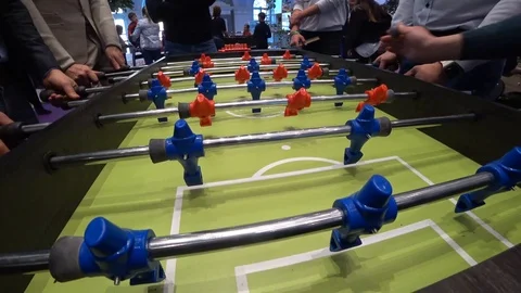 Men playing table soccer Stock Footage 88296101