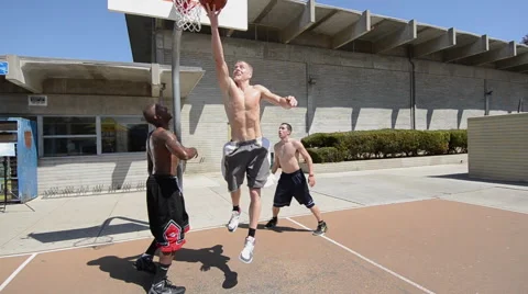 Men playing two-on-two pick up basketbal... | Stock Video | Pond5