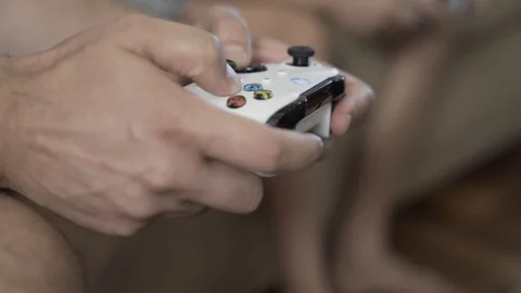 Men Playing With The White Xbox Gamepad Stock Footage 127628297