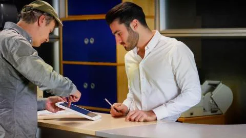 Men pointing at tablet PC screen Stock Photos