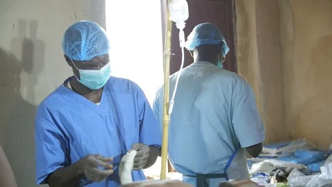 Men Prepare for Surgery co Stock Footage 115663216