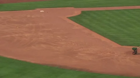 Men preparing baseball diamond for upcoming game - 02 Stock Footage 57363287