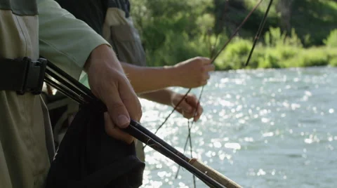 Men preparing for fly fishing 動画素材 59899227