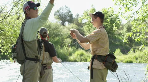 Men preparing for fly fishing 動画素材 59899327