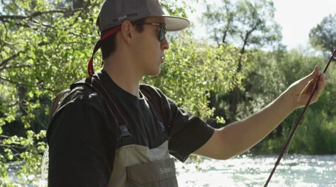 Men preparing for fly fishing Stock-Footage 59899346