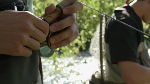 Men preparing for fly fishing Stock-Footage 59942888