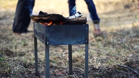 Men preparing grill and drinking beer Stock Footage 73477917