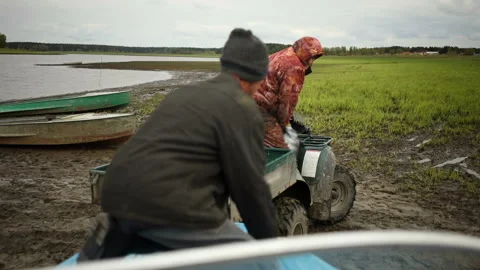 Men pull a boat on an ATV 스톡 동영상 93541834