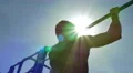 The men pull on the horizontal bar with bright sun with flare background 4k or 4k+ Resolution