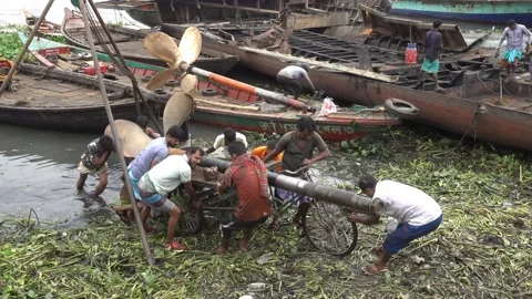 Men pull out of the water a rickshaw loa... | Stock Video | Pond5