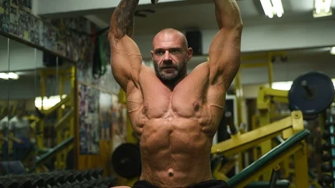 Men pumping up shoulders muscles workout fitness and bodybuilding concept Video stock 119077461