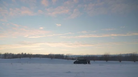 Men push broken van with engine problems in winter evening Video stock 83267702