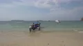 Men pushing a boat into the water in Panama 4k or 4k+ Resolution