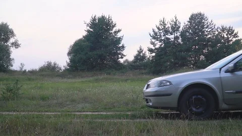 Men pushing a broken car Stock Footage 118464432