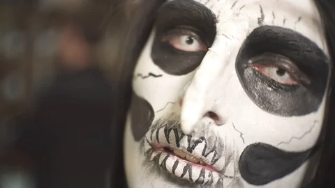 Men put makeup on the feast of Halloween. Stock Footage 97397907