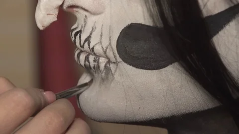 Men put makeup on the feast of Halloween. Stock Footage 97397922