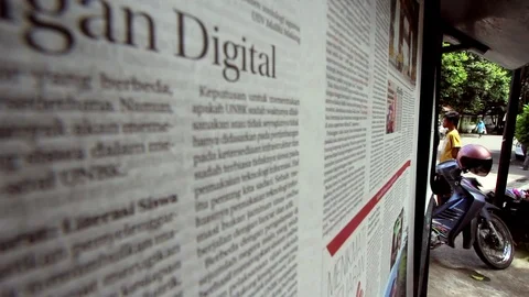 Men Read Newspapers On The Public Stand In Indonesia (3 of 4) Stock Footage 86008477
