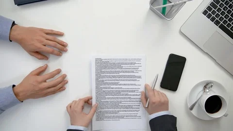 Men Reading a Document Stock Footage 84487686