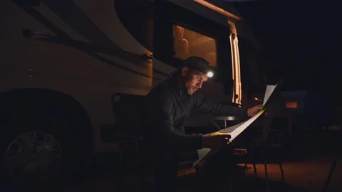 Men Reading Local Trials Map in Front of His Camper Van. Video stock 141038118