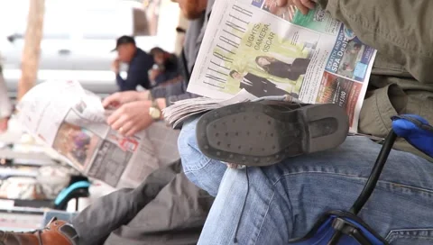 Men reading newspapers Stock Footage 1106305