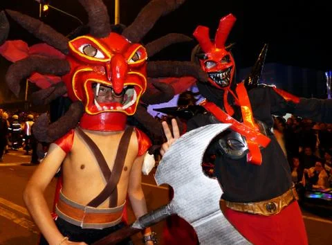 Men in red masks of Devil at the parade, Ecuador Stock Photos