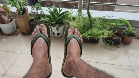 Men refreshing and swinging or swaying his legs in the rainy or wet season Stock Footage 132081100