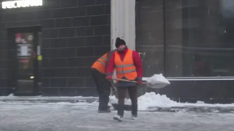 Men remove snow  Stock Footage 59144856