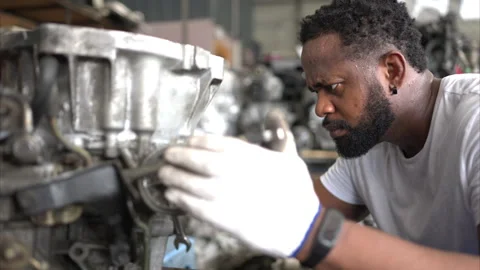 Men repairing car engine in auto repair shop, Selective focus. Stock Footage 257867604