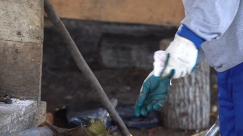 Men in respirators sort garbage. close-up of gloved hands Stock Footage 127369834