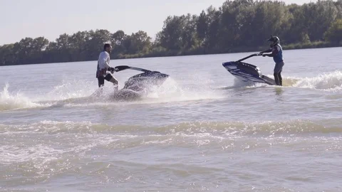 Men ride a jetski on a river Vídeos de archivo 96219726