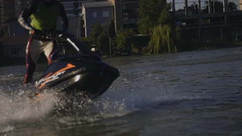 Men ride a jetski on a river Stock Footage 97145943