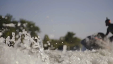 Men ride a jetski on a river Stock Footage 97146443