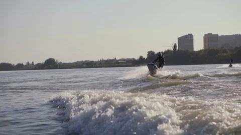 Men ride a jetski on a river Stock Footage 97146973