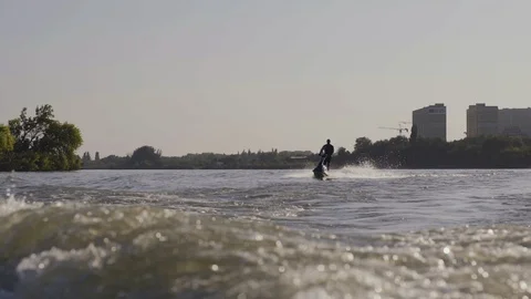 Men ride a jetski on a river Stock Footage 97147136