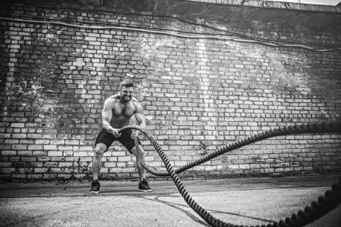 Men with rope, functional training Stock Photos