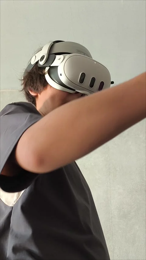 Men s gloved hands for playing VR glasses .Teen malchik is playing video games Stock Footage 313268415